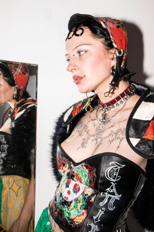 Pussy Tattie Clown thread portrait corset black pleather font striped