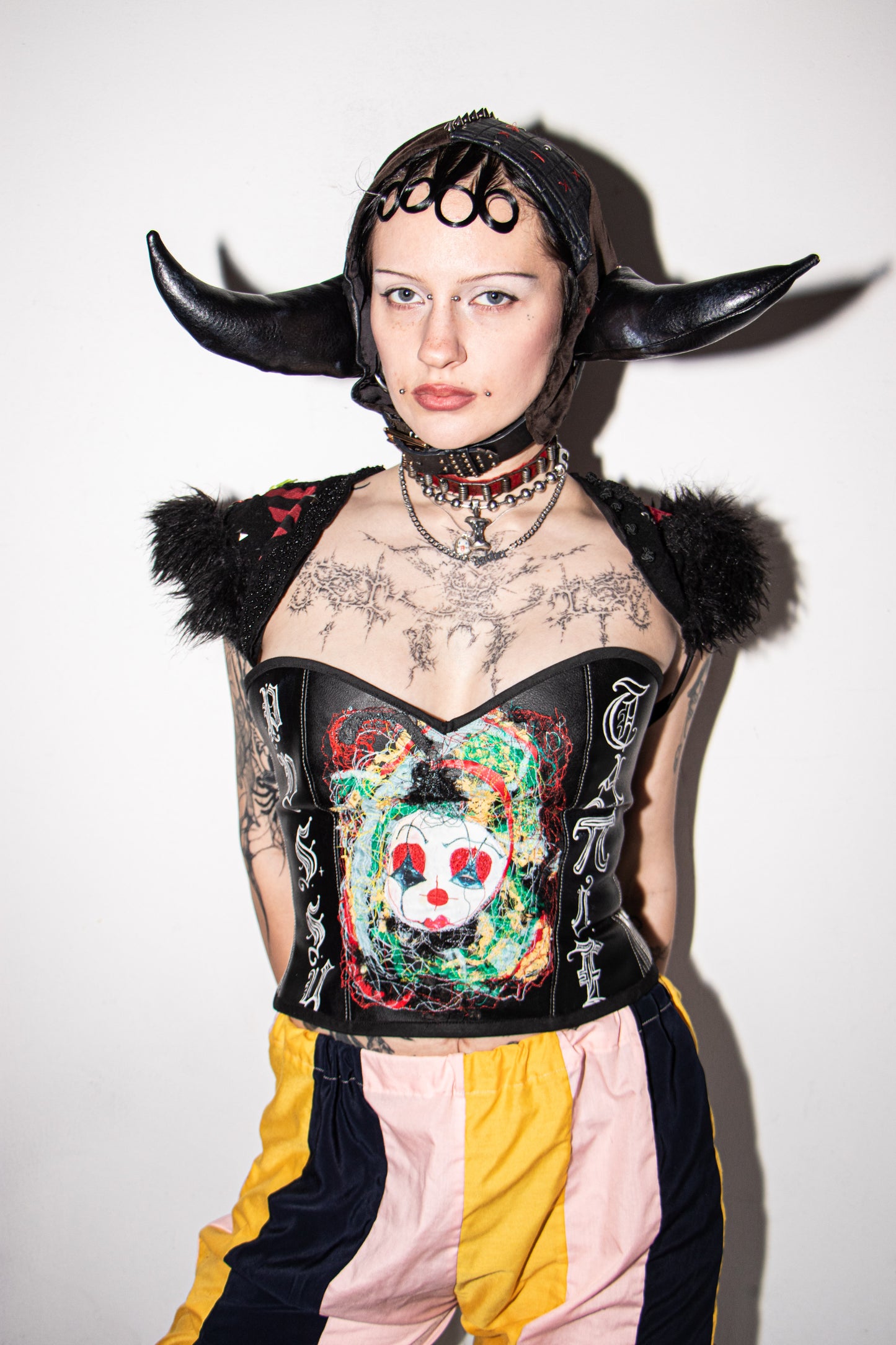 Pussy Tattie Clown thread portrait corset black pleather font striped