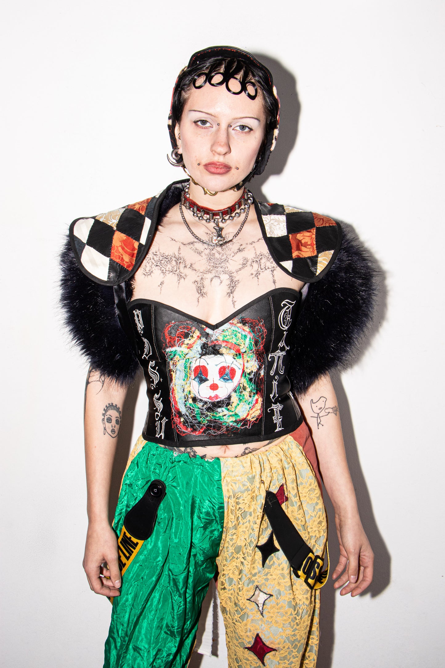 Pussy Tattie Clown thread portrait corset black pleather font striped